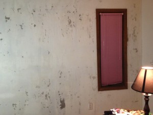 This is how my wall looks after scraping off the wall paper.